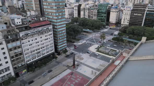 Traffic Near Teatro Colon (Colon Theater), An Opera House In Buenos Aires, Argentina. - aerial pullb