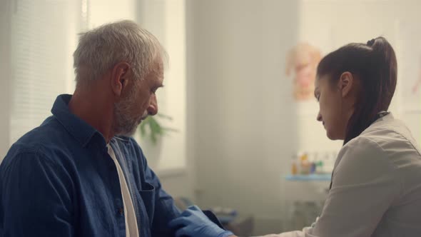 Woman Cardiologist Checkup Blood Pressure Pensioner Using Tonometer Closeup