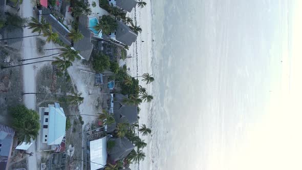 Vertical Video of the Ocean Near the Coast of Zanzibar Tanzania Aerial View