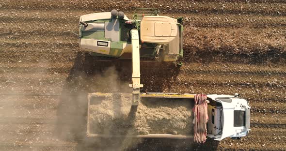 Aerial view of a tractor and a lorry working in a field, Kibbutz Saar, Israel.