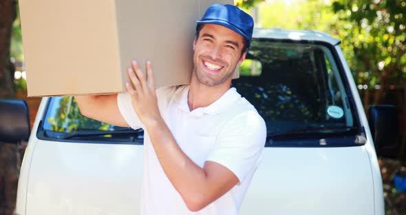 Delivery man carrying a parcel