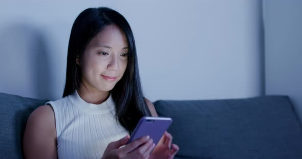 Woman use of cellphone at home