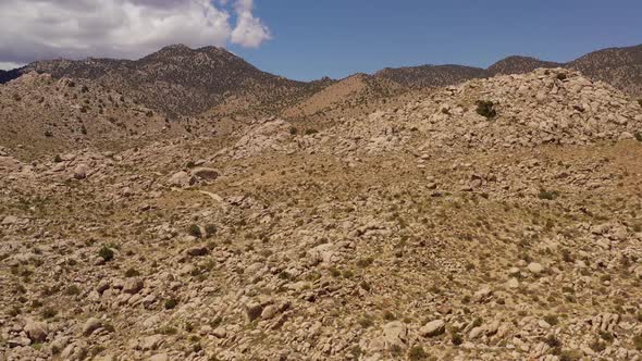 Aerial shot of interesting rock formations in the desert of California