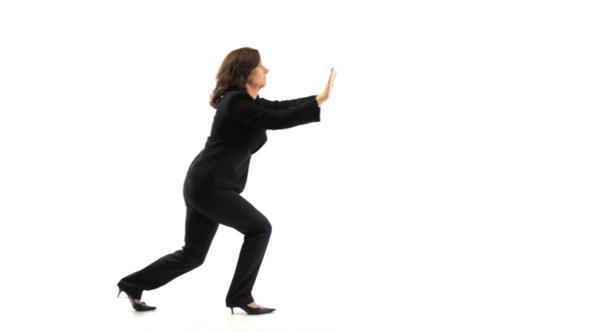 Businesswoman Pushing Something