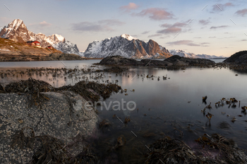 amatic mountains and peaks, open sea and sheltered bays, beaches and untouched lands. Though lying within the Arctic Circle, the archipelago experiences one of the world’s largest elevated temperature anomalies relative to its high latitude.
The breathtaking village of Reine is located on the island of Moskenesøya on northern Norway’s Lofoten archipelago. With red and white fishermen’s huts dotting the shoreline and surrounding peaks of granite shooting out of the Reinefjorden, the village has earned a reputation as “the most beautiful place in the world.