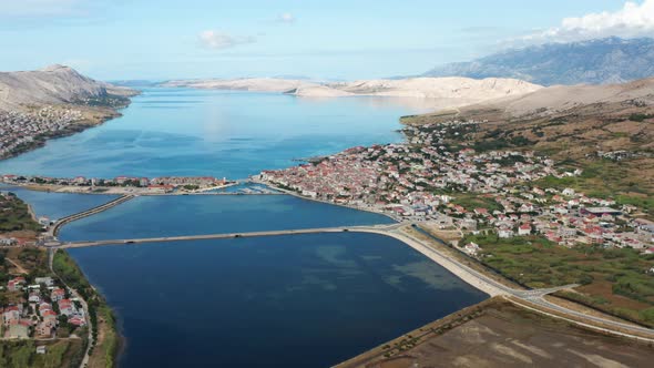 Aerial View Of Calm Sea With Seaside Town In Pag Island, Croatia.
