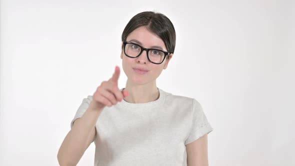 Focused Young Woman Pointing Finger on White Background