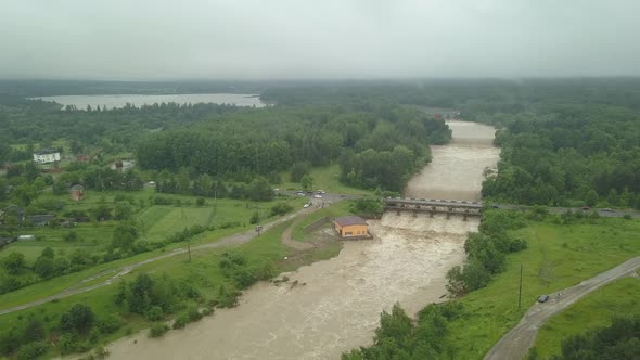 Aerial View of the Dam During Floods. Extremely High Water Level in the River.