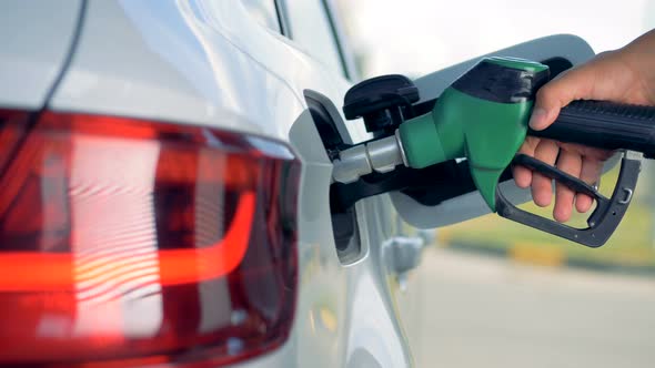 Fuel Nozzle Is Getting Inserted Into Automobile's Tank