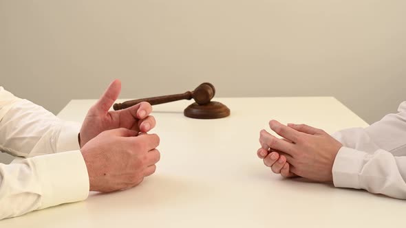 A Woman and a Man Take Off Their Wedding Rings