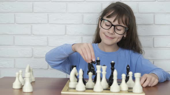 Child intellectual with chess. 