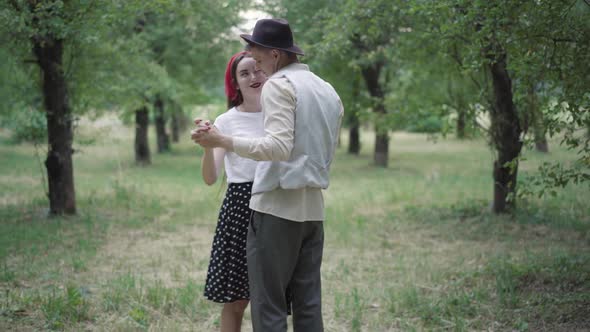 Slow Dance of Happy Elegant Young Couple in Summer Park, Smiling Loving Man and Woman Dancing