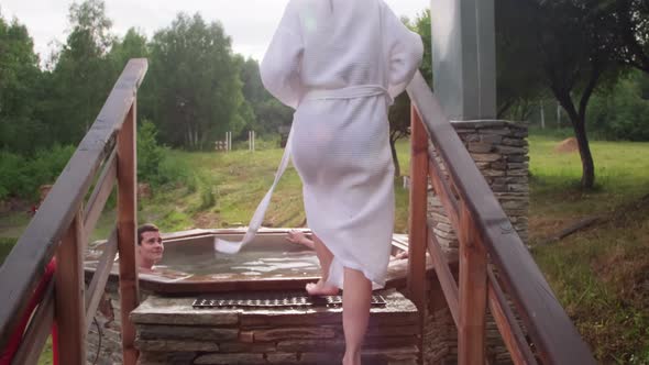 Friends Enjoying Hot Tub in Wilderness Resort