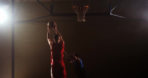 Sportsmen playing basketball