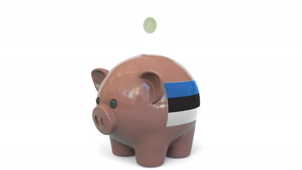 Putting Money Into Piggy Bank with Flag of Estonia
