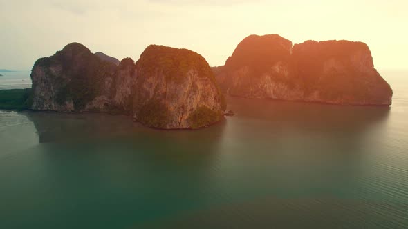 Aerial view over the coast, mountains and beaches during beautiful sunsets