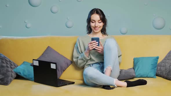 Woman Holding Smartphone and Watching a Funny Video Chating in Social Media