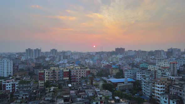 Red an orange sunset cityscape of Dhaka city urban area in Bangladesh, Asia