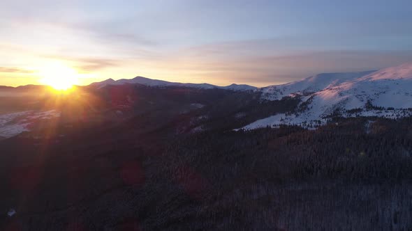 Aerial view in sunrise winter mountain