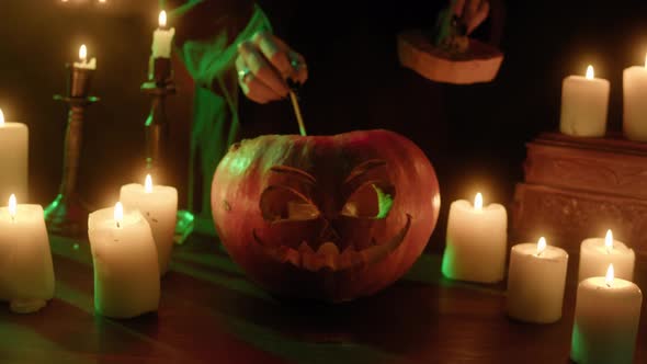 Lighting Candle in Carved Pumpkin Closeup