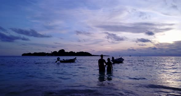 Fun lady and man on romantic honeymoon enjoy life on beach on summer white sandy 