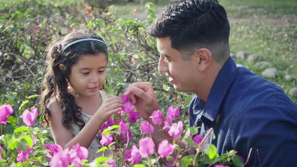 Dad and Daughter Surrounded by Flowers