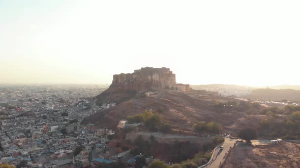 Mehrangarh Fort contrasting with golden sunset at the foothill of the border of Jodhpur, India