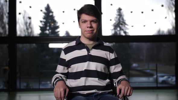 Portrait of Positive Teen Boy with Cerebral Palsy