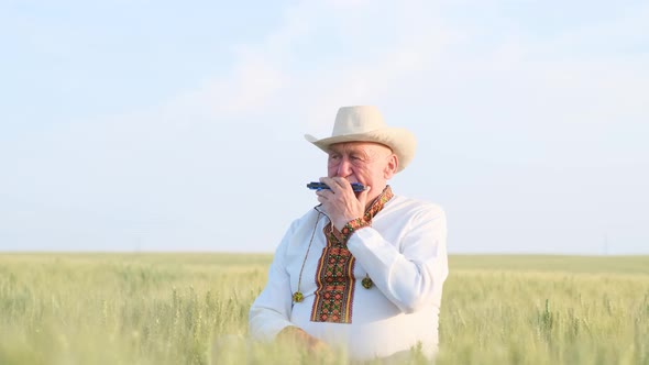 An Old Peasant in Ukrainian Clothes in a Field