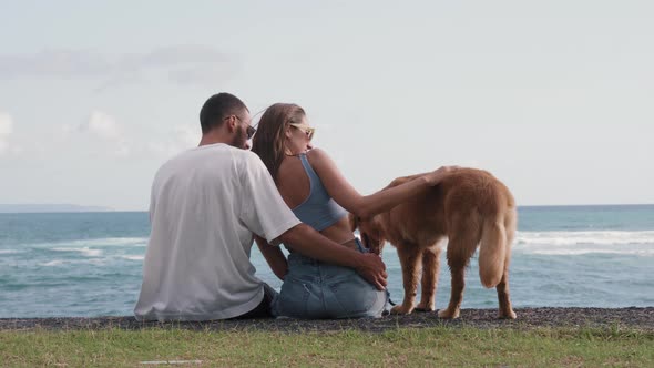 Romantic Couple and Dog at Seashore