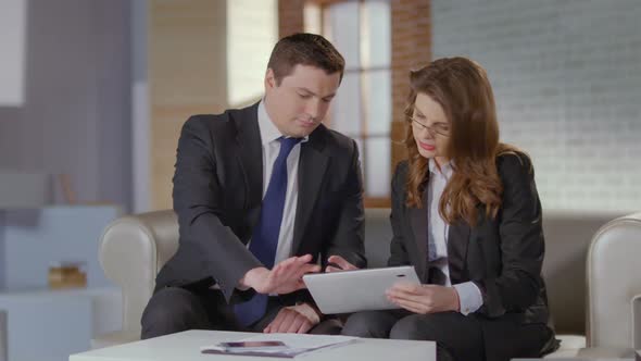 Man and Woman Discussing Business Matters in Office, Slow Motion