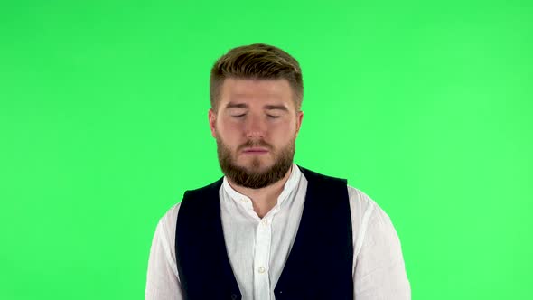 Man Stands Waiting with Boredom. Green Screen