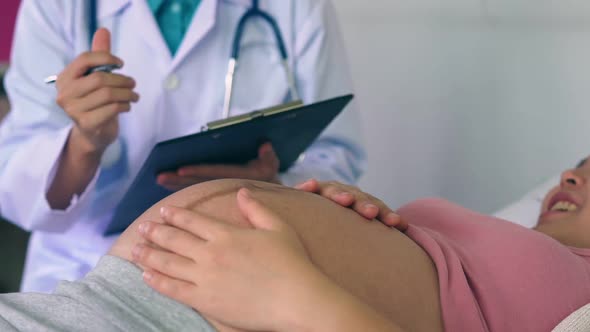 Pregnant Woman and Gynecologist Doctor at Hospital