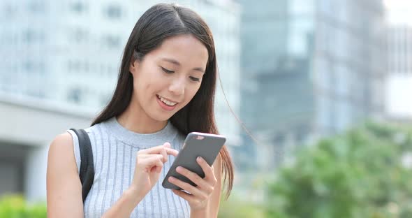 Woman using smart phone at outdoor