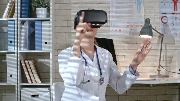 Female Doctor Working in VR Goggles