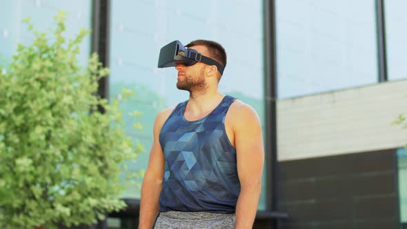 Happy Young Man with Vr Glasses Outdoors