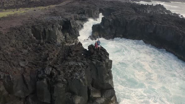 Aerial view of couple on coastal cliffs