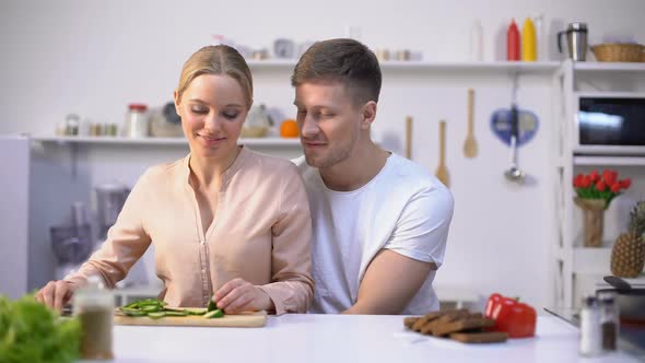 Romantic Couple Cooking Salad, Lovingly Embracing, Happy Healthy Vegan Lifestyle