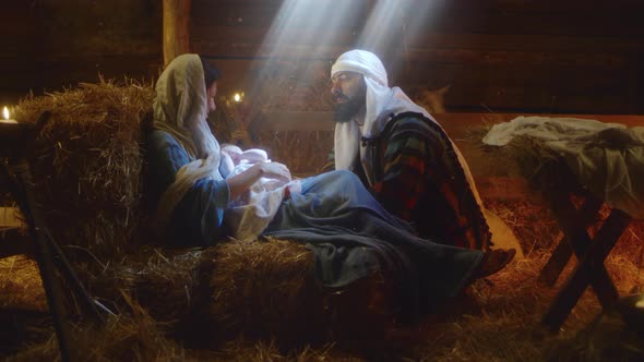 Joseph Speaking with Mary After Birth of Jesus