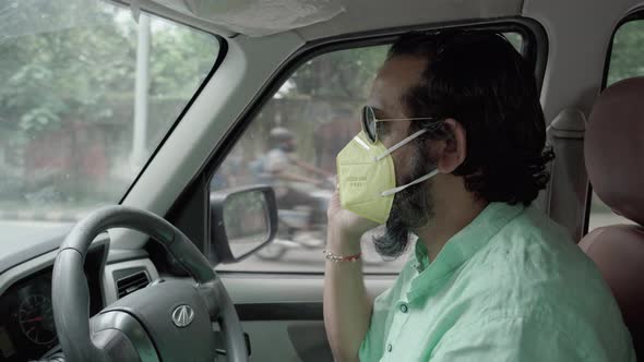 Indian Man Driving During Coronavirus Pandemic Removing His Face Mask Talking