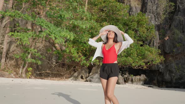 Woman Walking On Beach Of Entalula Beach