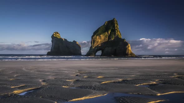 Archway on empty beach