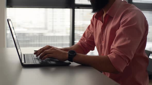 Closeup Cropped Shot of Unrecognizable Bearded Businessman Typing on Laptop Keyboard Working at