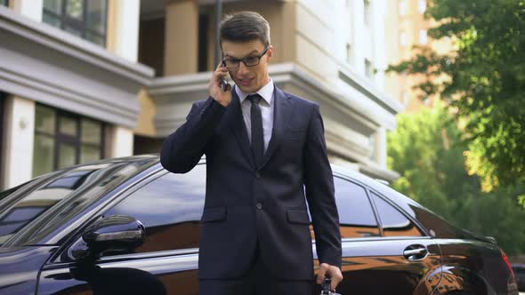 Anxious Young Man Talking on Phone With Contractor, Bad Fulfillment of Contract