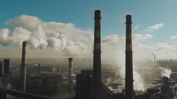 Smoke Industrial Pipes. Aerial view of the Industrial Plants. Pollution Ecology.