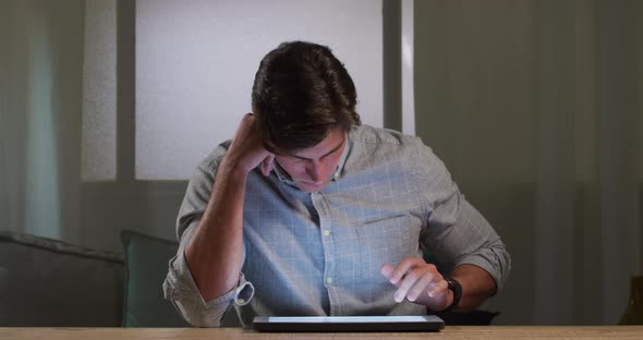 Caucasian man using a digital tablet