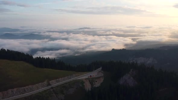 Spectacular Aerial View Over Mountain Road With Clouds