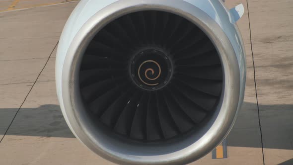 Closeup of a Slowmoving Aircraft Engine in the Parking Lot