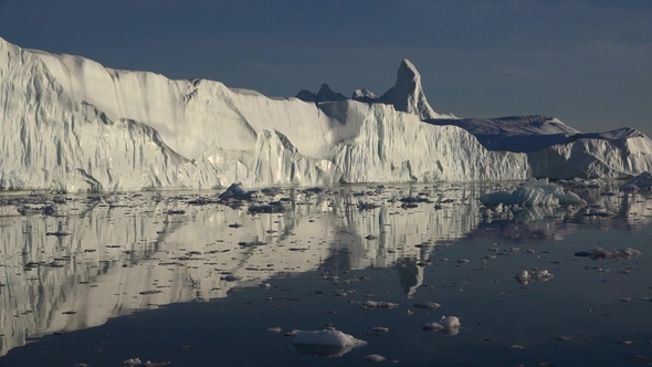 Arctic sailing among glaciers and floating ice blocks, in frozen sea and breathtaking landscape