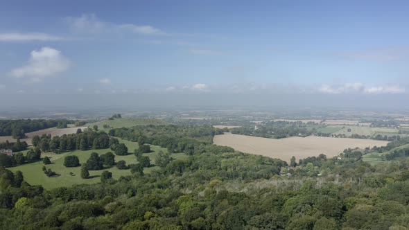 Drone shot of fields and forests in the countryside of Buckinghamshire, England